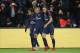 PARIS FRANCE - JANUARY 17: Kylian Mbappe of PSG celebrates his goal between Neymar Jr and Edinson Cavani during the French Ligue 1 match between Paris Saint Germain (PSG) and Dijon FCO at Parc des Princes stadium on January 17, 2018 in Paris, France. (Pho