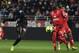 Nice's Italian forward Mario Balotelli (L) vies with Dijon's French-Algerian midfielder Mehdi Abeid during the French L1 football match between Dijon FCO and OGC Nice on February 10, 2018 at the Gaston Gerard stadium in Dijon, central-eastern France. /