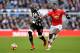 NEWCASTLE UPON TYNE, ENGLAND - FEBRUARY 11: Mohamed Diame of Newcastle United is challenged by Paul Pogba of Manchester United during the Premier League match between Newcastle United and Manchester United at St. James Park on February 11, 2018 in Newcas