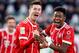 Bayern Munich's Polish forward Robert Lewandowski (L) celebrates with Bayern Munich's Austrian midfielder David Alaba (R) after scoring his team's second goal during the German first division Bundesliga football match between VfL Wolfsburg and FC Bayern M
