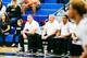 Mike Bibby, left, watches his team.