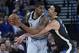 OAKLAND, CA - FEBRUARY 10: LaMarcus Aldridge #12 of the San Antonio Spurs looks to pass the ball while guarded by Zaza Pachulia #27 of the Golden State Warriors during an NBA basketball game at ORACLE Arena on February 10, 2018 in Oakland, California. NO