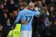 Manchester City's Spanish manager Pep Guardiola (R) embraces Manchester City's Belgian midfielder Kevin De Bruyne as he is substituted during the English Premier League football match between Manchester City and Watford at the Etihad Stadium in Manchester