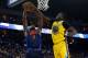 OAKLAND, CA - FEBRUARY 24: Draymond Green #23 of the Golden State Warriors fouls Jerami Grant #9 of the Oklahoma City Thunder while attempting to block the shot at ORACLE Arena on February 24, 2018 in Oakland, California. NOTE TO USER: User expressly ackn
