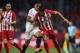 SEVILLE, SPAIN - FEBRUARY 25: Diego Costa of Atletico Madrid competes for the ball with Luis Muriel of Sevilla CF during the La Liga match between Sevilla CF and Atletico Madrid at Estadio Ramon Sanchez Pizjuan on February 25, 2018 in Seville, Spain. (P