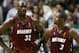 Shaquille O'Neal (L) of the Miami Heat talks with teammate Dwyane Wade (R) during Game Six of the NBA Finals against the Dallas Mavericks 20 June 2006 at the American Airlines Center in Dallas, Texas. The Miami Heat lead the best-of-seven game series 3-2