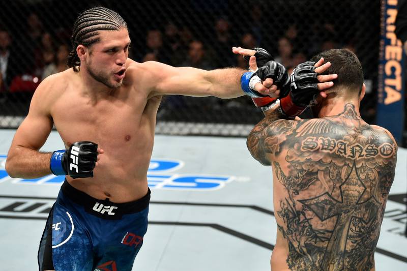 FRESNO, CA - DECEMBER 09: (L-R) Brian Ortega punches Cub Swanson in their featherweight bout during the UFC Fight Night event inside Save Mart Center on December 9, 2017 in Fresno, California. (Photo by Jeff Bottari/Zuffa LLC/Zuffa LLC via Getty Images)