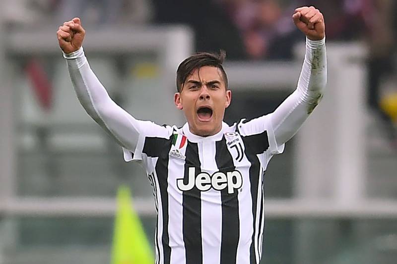 Juventus' Argentinian forward Paulo Dybala celebrates at the end of the Italian Serie A football match Torino Vs Juventus on February 18, 2018 at the Stadio Grande Torino stadium in Turin. / AFP PHOTO / MARCO BERTORELLO (Photo credit should read MA