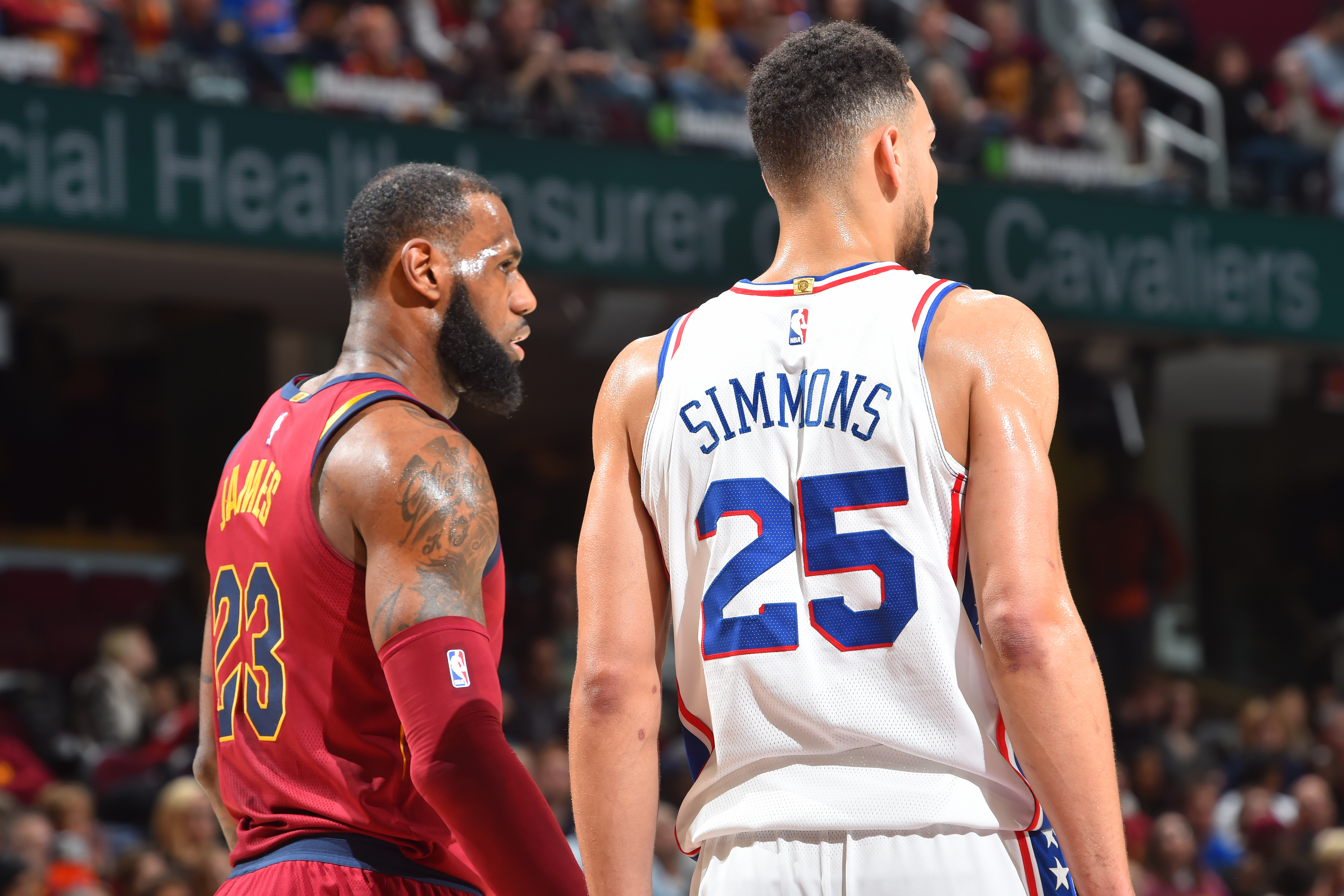 CLEVELAND, OH - DECEMBER 9: LeBron James #23 of the Cleveland Cavaliers and Ben Simmons #25 of the Philadelphia 76ers are seen on the court during the game on December 9, 2017 at Quicken Loans Arena in Cleveland, Ohio. NOTE TO USER: User expressly ackno