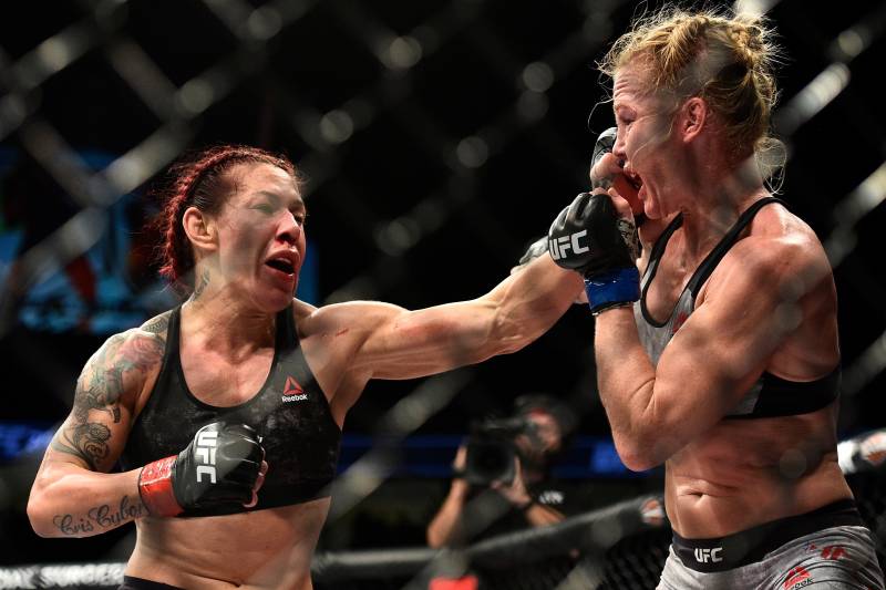 LAS VEGAS, NV - DECEMBER 30: (L-R) Cris Cyborg of Brazil punches Holly Holm in their women's featherweight bout during the UFC 219 event inside T-Mobile Arena on December 30, 2017 in Las Vegas, Nevada. (Photo by Brandon Magnus/Zuffa LLC/Zuffa LLC via Get