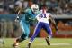 MIAMI GARDENS, FL - NOVEMBER 13: Ja'Wuan James #70 of the Miami Dolphins defends against Manny Lawson #91 of the Buffalo Bills on November 13, 2014 at Sun Life Stadium in Miami Gardens, Florida. The Dolphins defeated the Bills 22-9. (Photo by Joel Auerbac