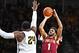 WICHITA, KS - NOVEMBER 13: Guard Grant Riller #1 of the College of Charleston Cougars puts up a shot against forward Shaquille Morris #24 of the Wichita State Shockers during the second half on November 13, 2017 at Charles Koch Arena in Wichita, Kansas.