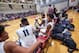 Mohamed Bamba (11) and Cam Reddish talk on Westtown bench.