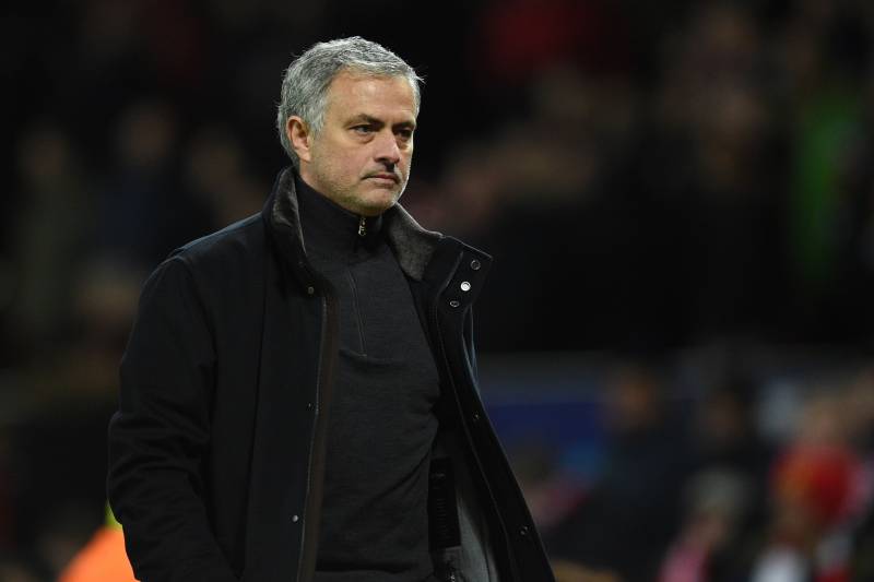 Manchester United's Portuguese manager Jose Mourinho leaves the pitch after losing a last 16 second leg UEFA Champions League football match between Manchester United and Sevilla at Old Trafford in Manchester, northwest England on March 13, 2018. / AFP PH