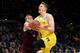 LOS ANGELES, CA - MARCH 22: Moritz Wagner #13 of the Michigan Wolverines is fouled by DJ Hogg #1 of the Texas A&M Aggies in the first half in the 2018 NCAA Men's Basketball Tournament West Regional at Staples Center on March 22, 2018 in Los Angeles, Cali