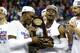 OMAHA, NE - MARCH 25: Lagerald Vick #2 and Malik Newman #14 of the Kansas Jayhawks celebrate with the regional championship trophy after defeating the Duke Blue Devils in the 2018 NCAA Men's Basketball Tournament Midwest Regional at CenturyLink Center on