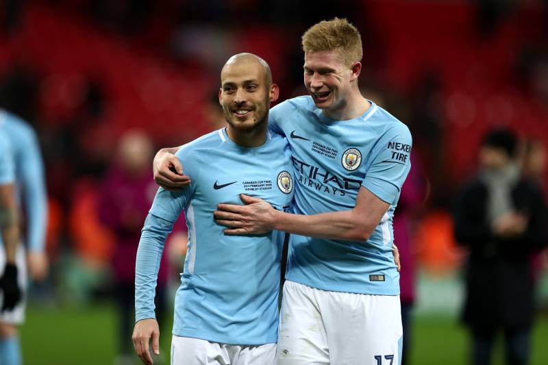 LONDON, ENGLAND - FEBRUARY 25: David Silva and Kevin De Bruyne of Manchester City celebrate after the Carabao Cup Final between Arsenal and Manchester City at Wembley Stadium on February 25, 2018 in London, England. (Photo by Catherine Ivill/Getty Image