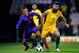 LONDON, ENGLAND - MARCH 27: Mateus Uribe of Columbia competes for the ball with Mile Jedinak of Australia during the International friendly between Australia and Colombia at Craven Cottage on March 27, 2018 in London, England. (Photo by Julian Finney/Get