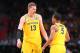 SAN ANTONIO, TX - MARCH 31: Moritz Wagner #13 and Jaaron Simmons #5 of the Michigan Wolverines discuss the play against the Loyola Ramblers in the first half during the 2018 NCAA Men's Final Four Semifinal at the Alamodome on March 31, 2018 in San Antoni