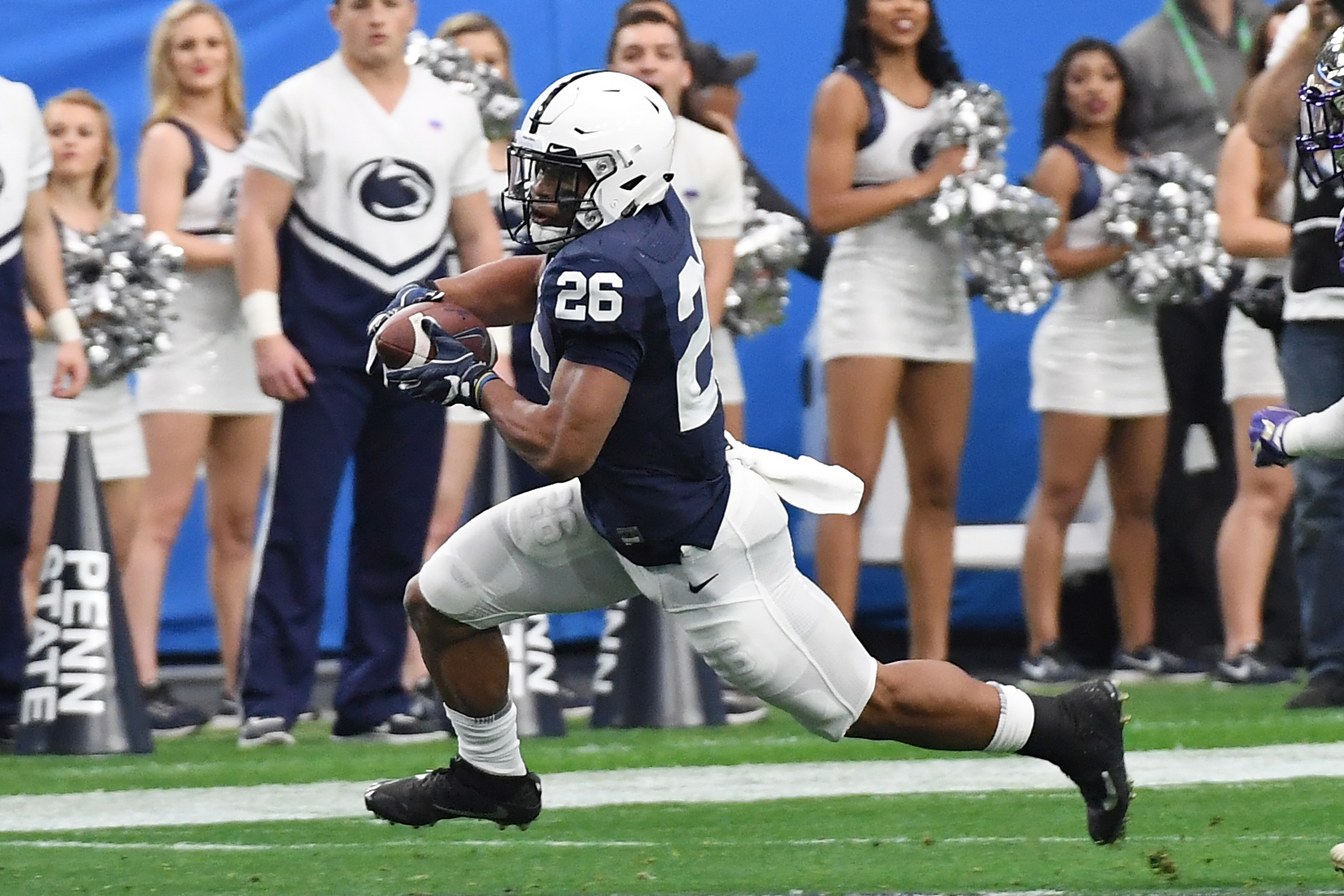GLENDALE, AZ - DECEMBER 30: Saquon Barkley #26 of Penn State Nittany Lions runs with the ball against the Washington Huskies during the Playstation Fiesta Bowl at University of Phoenix Stadium on December 30, 2017 in Glendale, Arizona. (Photo by Norm Ha