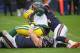 CHICAGO, IL - NOVEMBER 12: Brett Hundley #7 of the Green Bay Packers is sacked by Leonard Floyd #94 and Nick Kwiatkoski #44 of the Chicago Bears at Soldier Field on November 12, 2017 in Chicago, Illinois. (Photo by Jonathan Daniel/Getty Images)