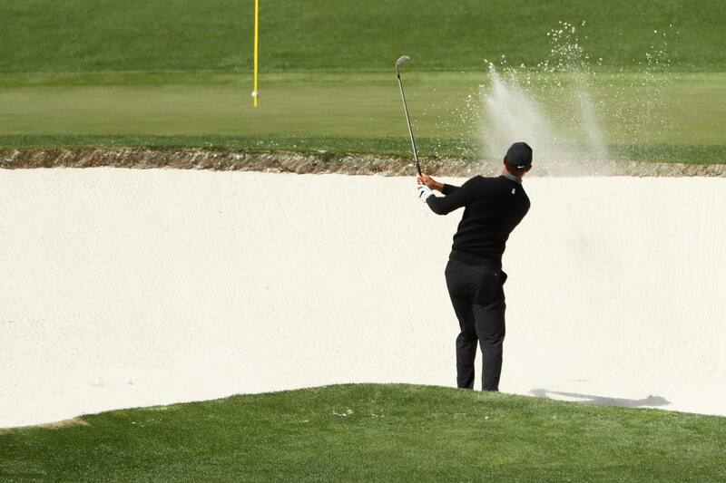AUGUSTA, GA - APRIL 05: Tiger Woods of the United States plays a shot from a greenside bunker on the fourth hole during the first round of the 2018 Masters Tournament at Augusta National Golf Club on April 5, 2018 in Augusta, Georgia. (Photo by Jamie Sq