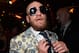 McGregor in a custom suit following the Mayweather fight.