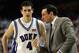 JJ Redick receives advice from Mike Krzyzewski while at Duke, where Redick starred as a rare NBA prospect staying through his senior year.