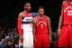 WASHINGTON, DC - NOVEMBER 28: John Wall #2 of the Washington Wizards talks with Kyle Lowry #7 of the Toronto Raptors during the game on November 28, 2015 at Verizon Center in Washington, DC. NOTE TO USER: User expressly acknowledges and agrees that, by