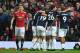 Manchester United's Serbian midfielder Nemanja Matic (L) who's error led to the goal, reacts as West Brom players celebrate their opening goal during the English Premier League football match between Manchester United and West Bomwich Albion at Old Traffo