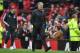 Manchester United's Portuguese manager Jose Mourinho walks off after the English Premier League football match between Manchester United and West Bomwich Albion at Old Trafford in Manchester, north west England, on April 15, 2018.
Manchester City were cro