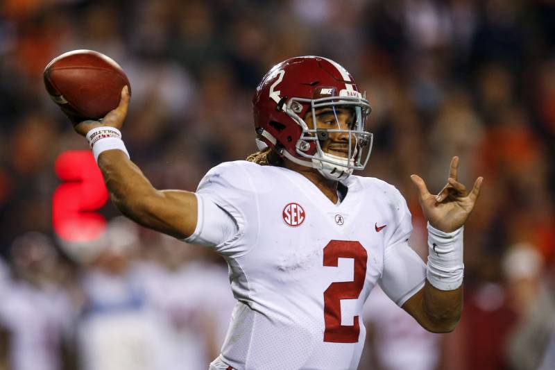 Jalen Hurts drops back to pass in loss to Auburn.