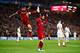 LIVERPOOL, ENGLAND - APRIL 24: Mohamed Salah of Liverpool and teammate Roberto Firmino celebrate after scoring his sides second goal during the UEFA Champions League Semi Final First Leg match between Liverpool and A.S. Roma at Anfield on April 24, 2018