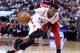 TORONTO, ON - APRIL 25: Delon Wright #55 of the Toronto Raptors dribbles the ball as Ty Lawson #4 of the Washington Wizards defends during the second half of Game Five in Round One of the 2018 NBA playoffs at Air Canada Centre on April 25, 2018 in Toront