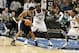 MINNEAPOLIS - DECEMBER 15: Tim Duncan #21 of the San Antonio Spurs looks to make a move around Kevin Garnett #21 of the Minnesota Timberwolves on December 15, 2005 at the Target Center in Minneapolis, Minnesota. NOTE TO USER: User expressly acknowledges