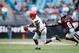 JACKSONVILLE, FL - DECEMBER 30: Lamar Jackson #8 of the Louisville Cardinals looks to pass while under pressure from Willie Gay Jr. #6 of the Mississippi State Bulldogs during the TaxSlayer Bowl at EverBank Field on December 30, 2017 in Jacksonville, Flor