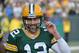 GREEN BAY, WI - DECEMBER 24: Aaron Rodgers #12 of the Green Bay Packers returns to the bench following a touchdown during a game against the Minnesota Vikings at Lambeau Field on December 24, 2016 in Green Bay, Wisconsin. (Photo by Tom Dahlin/Getty Images