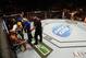 Referee John McCarthy and a Nevada State Athletic Commission official attempt to get Yoel Romero off his stool at UFC 178.