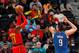 ATLANTA, GA - DECEMBER 09: Dennis Schroder #17 of the Atlanta Hawks shoots against Nikola Vucevic #9 of the Orlando Magic to end the first half at Philips Arena on December 9, 2017 in Atlanta, Georgia. NOTE TO USER: User expressly acknowledges and agree