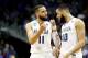 ATLANTA, GA - MARCH 22: Cody Martin #11 and Caleb Martin #10 of the Nevada Wolf Pack discuss the play against the Loyola Ramblers in the second half during the 2018 NCAA Men's Basketball Tournament South Regional at Philips Arena on March 22, 2018 in Atla