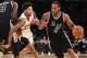 LOS ANGELES, CA - FEBRUARY 26: Kawhi Leonard #2 of the San Antonio Spurs drives to the basket as he gets past Brandon Ingram #14 of the Los Angeles Lakers in the second half of the game at Staples Center on February 26, 2017 in Los Angeles, California. S