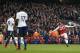 Arsenal's German defender Shkodran Mustafi (R) celebrates scoring the team's first goal as Tottenham Hotspur's Belgian midfielder Mousa Dembele (L) and Tottenham Hotspur's French midfielder Moussa Sissoko look on during the English Premier League football