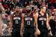 PORTLAND, OR - NOVEMBER 27: James Harden #13, Clint Capela #15 and Ryan Anderson #3 of the Houston Rockets look on during the game against the Portland Trail Blazers on November 27, 2016 at the Moda Center in Portland, Oregon. NOTE TO USER: User expressly