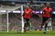 MANCHESTER, ENGLAND - APRIL 07: Chris Smalling of Manchester United celebrates scoring his side's third goal with Paul Pogba during the Premier League match between Manchester City and Manchester United at Etihad Stadium on April 7, 2018 in Manchester, E