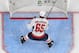 LAS VEGAS, NV - MAY 30: Andre Burakovsky #65 of the Washington Capitals clears pucks from a net during warmups before Game Two of the 2018 NHL Stanley Cup Final at T-Mobile Arena on May 30, 2018 in Las Vegas, Nevada. The Capitals defeated the Golden Knig