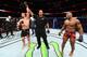 CHICAGO, ILLINOIS - JUNE 09: (L-R) Robert Whittaker of New Zealand celebrates after defeating Yoel Romero of Cuba by split decision in their middleweight fight during the UFC 225 event at the United Center on June 9, 2018 in Chicago, Illinois. (Photo by