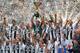 TOPSHOT - Juventus' goalkeeper from Italy Gianluigi Buffon (C) lifts the trophy during the victory ceremony following the Italian Serie A last football match of the season Juventus versus Verona, on May 19, 2018 at the Allianz Stadium in Turin. Juventus w
