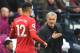 Manchester United's Portuguese manager Jose Mourinho (R) has a word with Manchester United's English defender Chris Smalling (L) on the touchline during the English Premier League football match between Manchester City and Manchester United at the Etihad