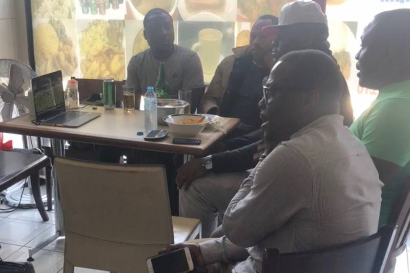 Nigerian fans watch a stream in London.