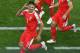 Serbia's forward Aleksandar Mitrovic (L) celebrates after scoring the opening goal during the Russia 2018 World Cup Group E football match between Serbia and Switzerland at the Kaliningrad Stadium in Kaliningrad on June 22, 2018. (Photo by Patrick HERTZ